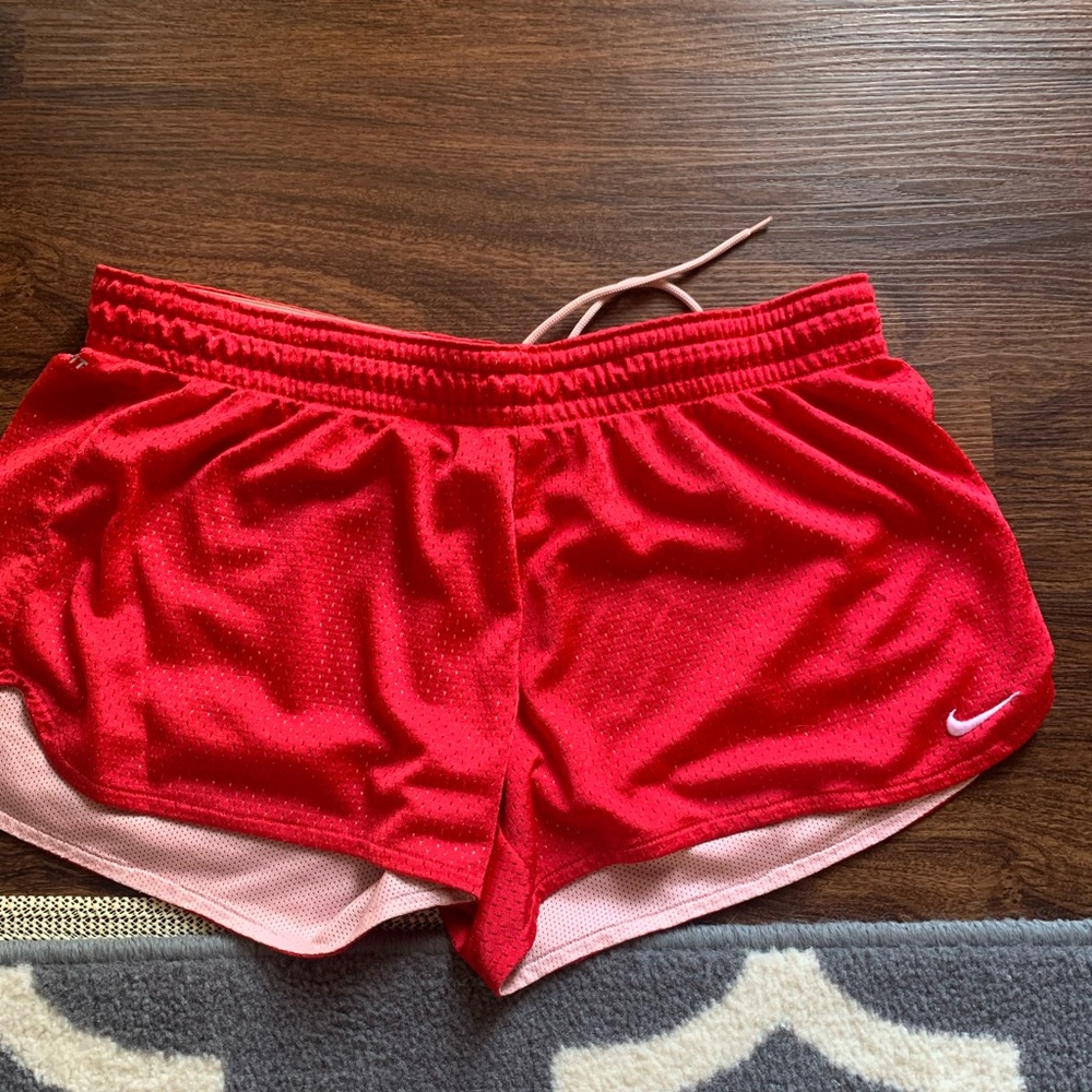 Red Nike athletic shorts